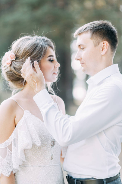 Stylish European wedding at sunset. Happy couple in the forest on the lake.  - 写真・画像
