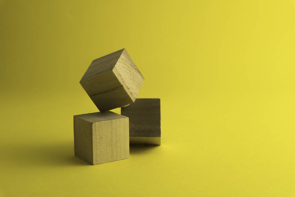 wooden blocks on a yellow background. - Photo, Image