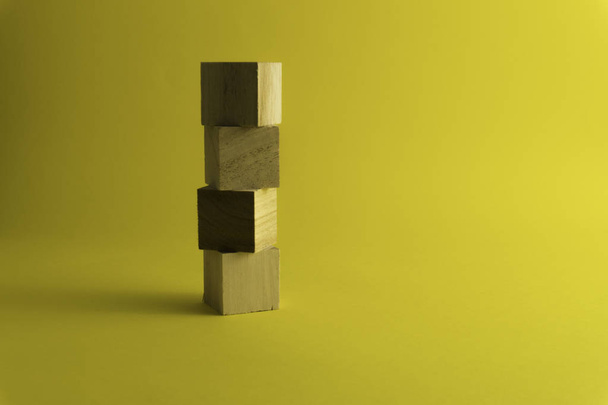 wooden blocks on a yellow background. - Photo, Image