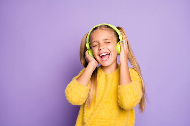 Portrait of crazy funky child use green headset listen radio music sing song wear casual style pullover isolated over purple color background - Zdjęcie, obraz