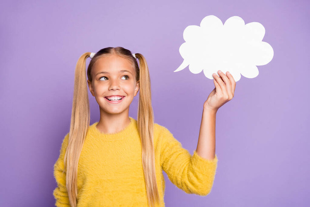 Portrait of interested cheerful kid hold paper card cloud think thoughts about future weekends wear stylish jumper isolated over violet color background - Foto, immagini