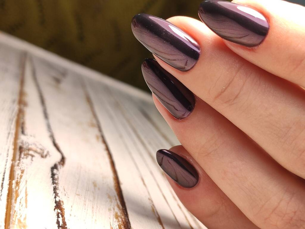 Gray striped nail design on female hand close up. - Photo, Image