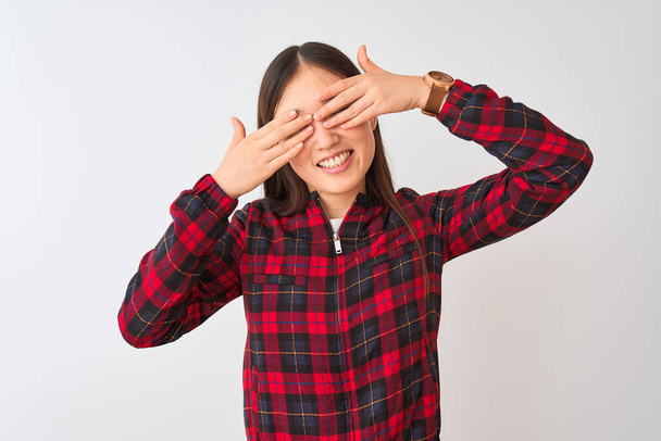 Young chinese woman wearing casual jacket standing over isolated white background covering eyes with hands smiling cheerful and funny. Blind concept. - Foto, Bild