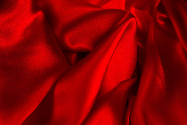 Червоний шовк або атласна розкішна тканина може використовуватись як абстрактна спинка
 - Фото, зображення
