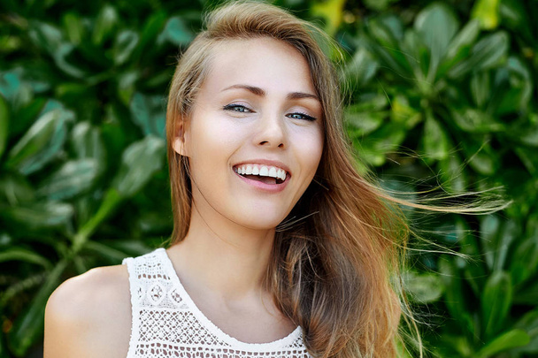 Beautiful smiling woman outdoor portrait - Photo, Image