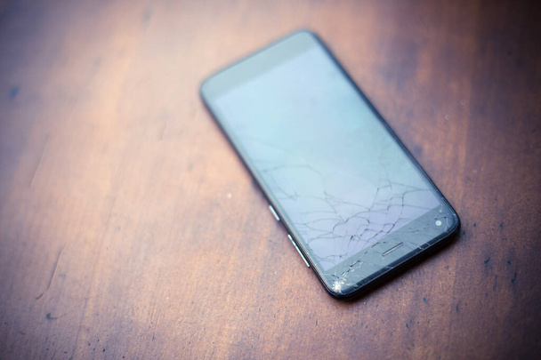 Mobile phone with broken screen - Фото, зображення