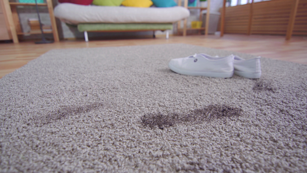 Dirty footprints and shoes on the carpet - Footage, Video