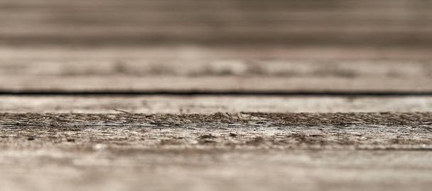 Texture of old wooden boards. Focus in the center of the photo. Background in blur. - Φωτογραφία, εικόνα
