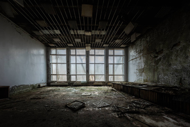 Large broken windows of abandoned building - 写真・画像