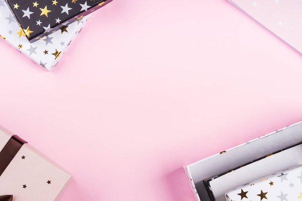 Gift boxes frame on pink. Festive concept flat lay - Zdjęcie, obraz