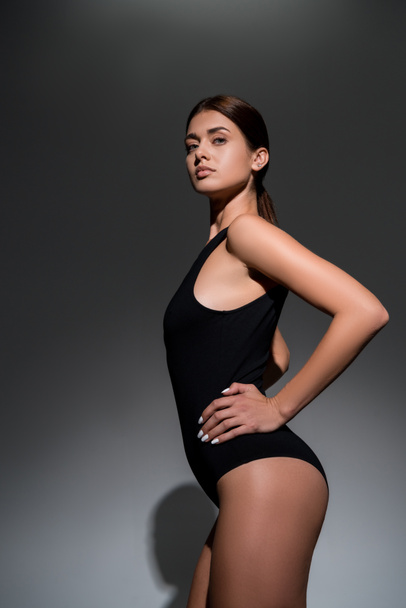beautiful young model posing on black background - Fotografie, Obrázek