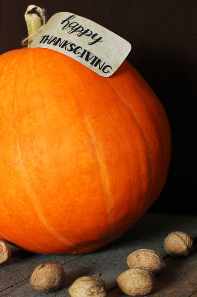The inscription "Happy Thanksgiving" on the pumpkin - Фото, изображение
