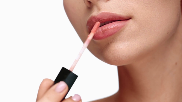 cropped view of woman applying lip balm  - 映像、動画