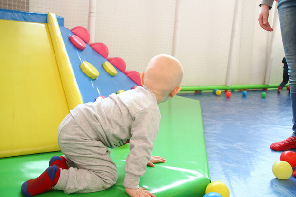 Beautiful baby boy playing at playland - Photo, Image