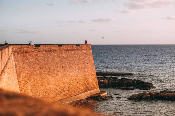 ALGHERO, ITALY/ OCTOBER 2019:  A woman is relaxing the wonderful - 写真・画像