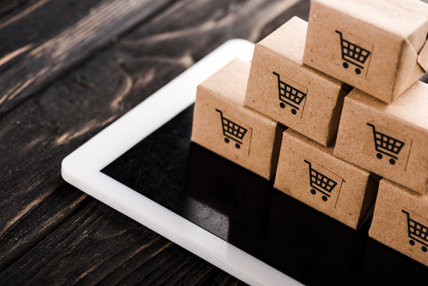 selective focus of small carton boxes on digital tablet, e-commerce concept - Photo, Image