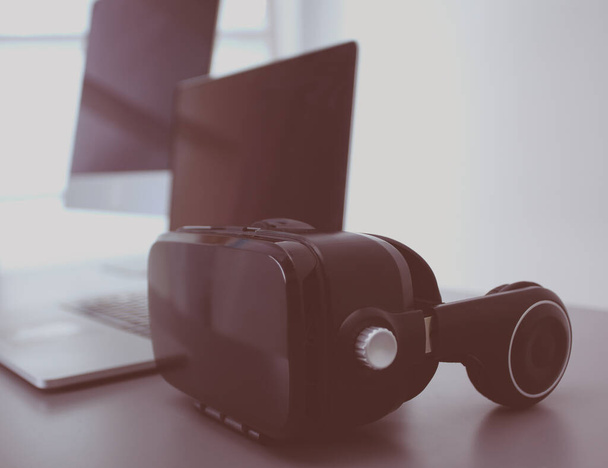 Virtual reality goggles on desk with laptop. business. 3d technology - Fotografie, Obrázek