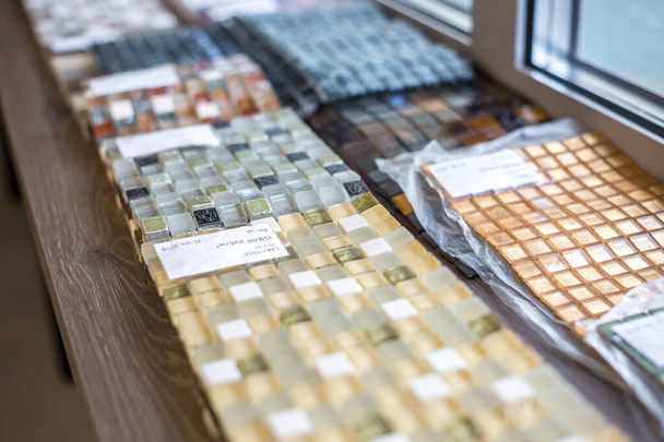 GRODNO, BELARUS - JUNE 2019: rows of ceramic tiles and natural stone inside of interior modern showroom shop - 写真・画像