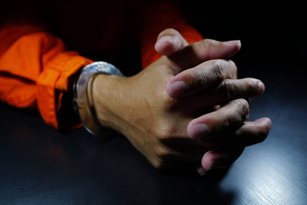 Close-up Of male  Hands  In handcuffs  - Foto, Bild
