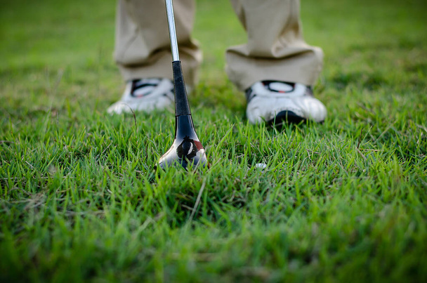 Golfers are holding a golf club and golf ball moving - Foto, afbeelding
