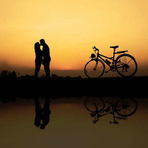 Young couple admiring sunset. Travel - Фото, зображення