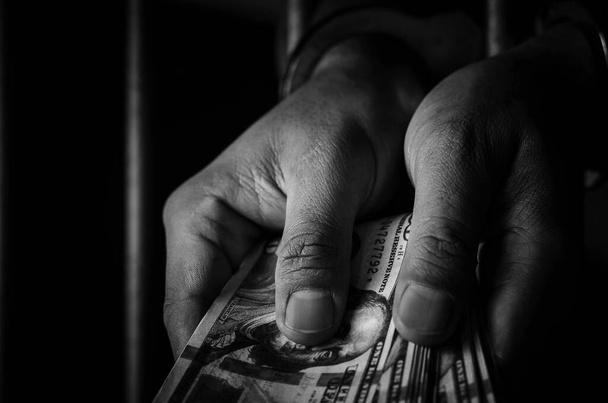 Close-up Of male  Hands  In handcuffs with dollars  - Foto, immagini