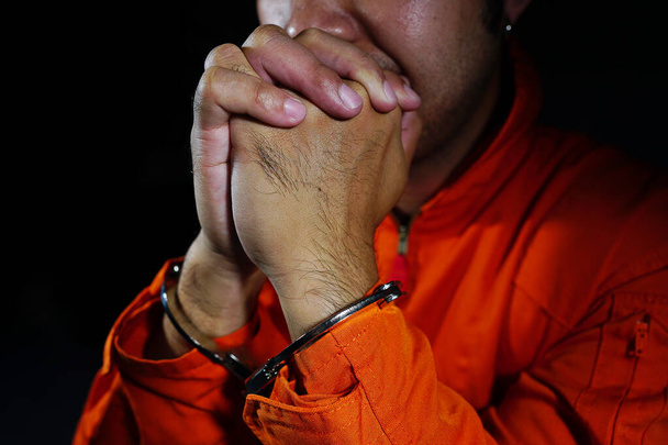 Stressed by prisoners shackled in a dark room                                - Foto, Bild