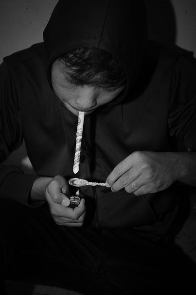 Asian addicted young man  - Fotoğraf, Görsel