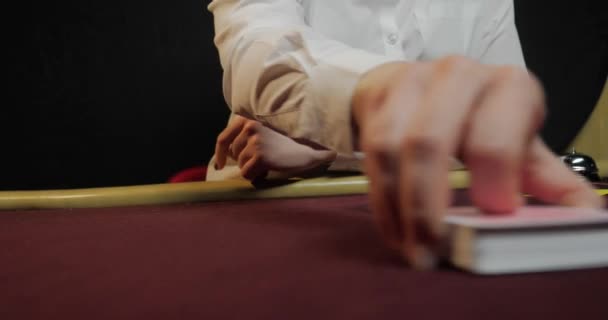 Poker dealer shuffling full deck of playing cards - Footage, Video