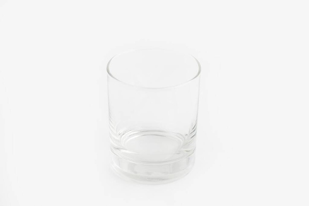 Closeup shot of an old fashioned glass isolated on a white background - Фото, зображення
