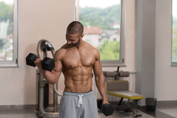 Man With Dumbbells Exercising Biceps - Zdjęcie, obraz