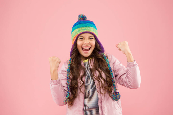 happy me. warm clothes for cold season. small girl winter hat. ready for winter activity. kid fashion. trendy girl smiling. child feel success pink background. autumn style. happy childhood - Fotografie, Obrázek