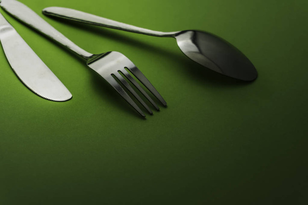 Fork and spoon on dark background, Restaurant concept.  - Photo, Image