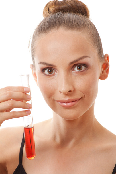 Woman holding test tube with red liquid - Zdjęcie, obraz