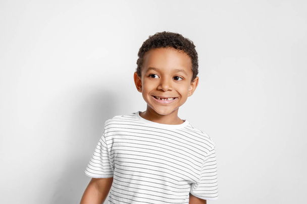 Cute African-American boy on white background - Φωτογραφία, εικόνα