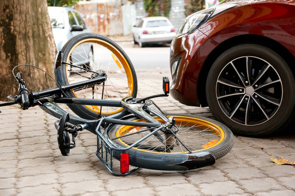 Accident between car and bicycle on city street - Photo, Image
