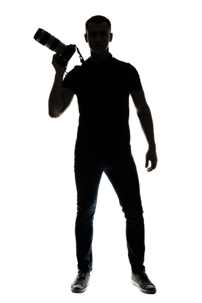 Σιλουέτα του αρσενικό φωτογράφος σε λευκό φόντο - Φωτογραφία, εικόνα