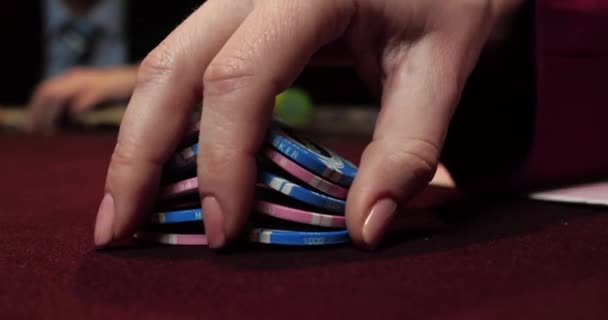 hands of woman dealer with cards in poker tour . Group of professional poker players gather at players table gambling in poker tournament, championship . - Footage, Video