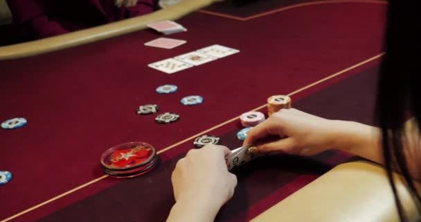 People playing poker, man looking at his cards and pushing chips, all-in - Footage, Video