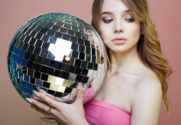 Beautiful young blond woman with mirror ball - Fotografie, Obrázek