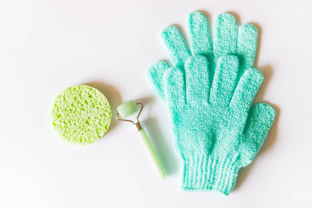 Green roller and gloves. - Photo, Image