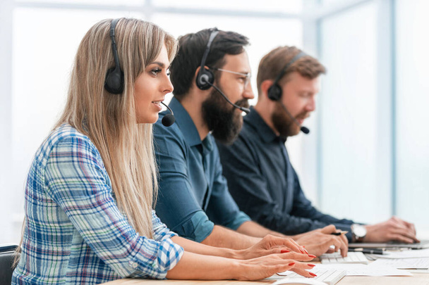 call center operators use computers to work with clients. - Фото, изображение