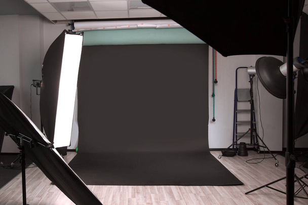Empty photographic Studio with modern lighting equipment. - Фото, изображение