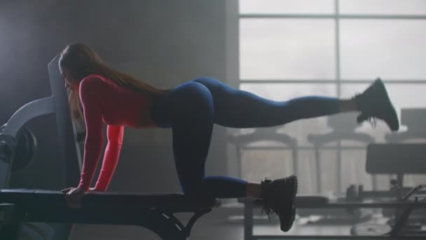 Woman is doing exercises on the buttocks - Footage, Video