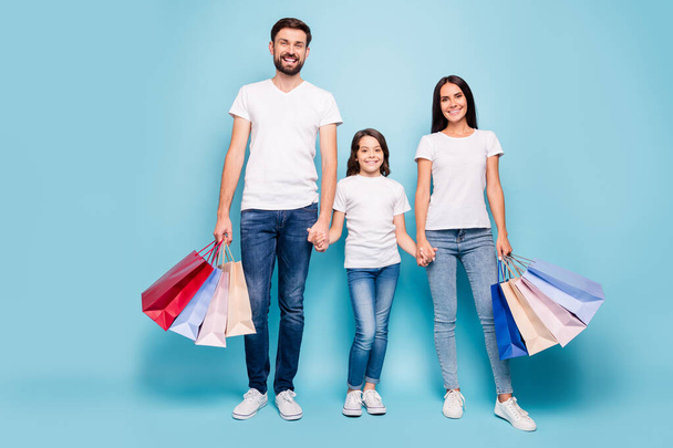 New boutique collection. Full size photo of beautiful dream three people mom dad schoolkid with brown hair shop retail wear white t-shirt denim jeans sneakers isolated over blue color background - Foto, immagini