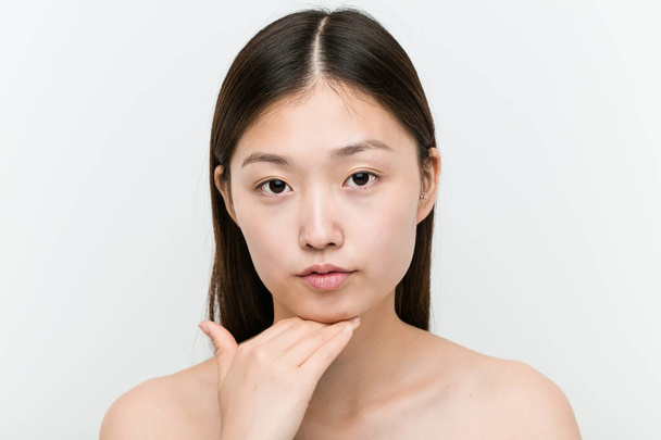 Close up of a young beautiful and natural asian woman - Photo, Image