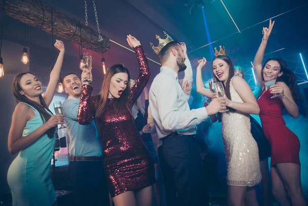 Clink cheers toast for excited prince and princess. Photo of excited cheerful glad carefree buddies celebrating prom with winners drinking alcohol beverages - Photo, Image