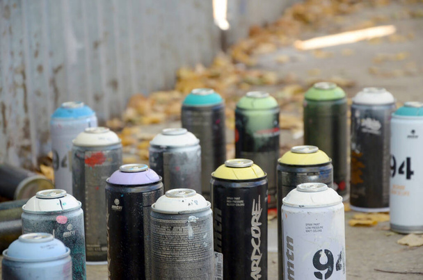 KHARKOV, UKRAINE - OCTOBER 19, 2019: Montana mtn 94 black hardcore dope and kobra used spray cans for graffiti painting outdoors in autumn leafs - Foto, Bild