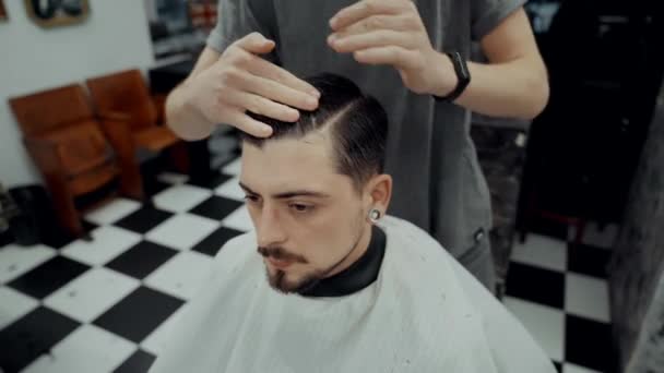 Haircut and beard haircut in barbershop.  - Video