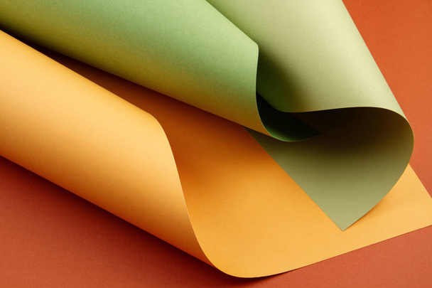 Abstract backgroud of rolled textured paper sheets of different  - Фото, зображення